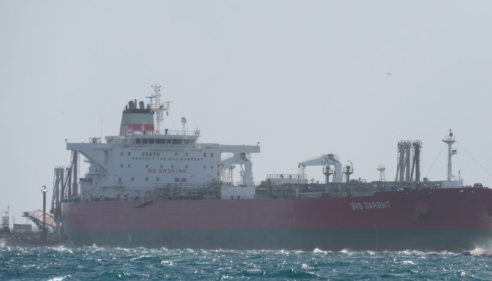 Crude oil tanker approaching a loading terminal — crude oil trading cargo